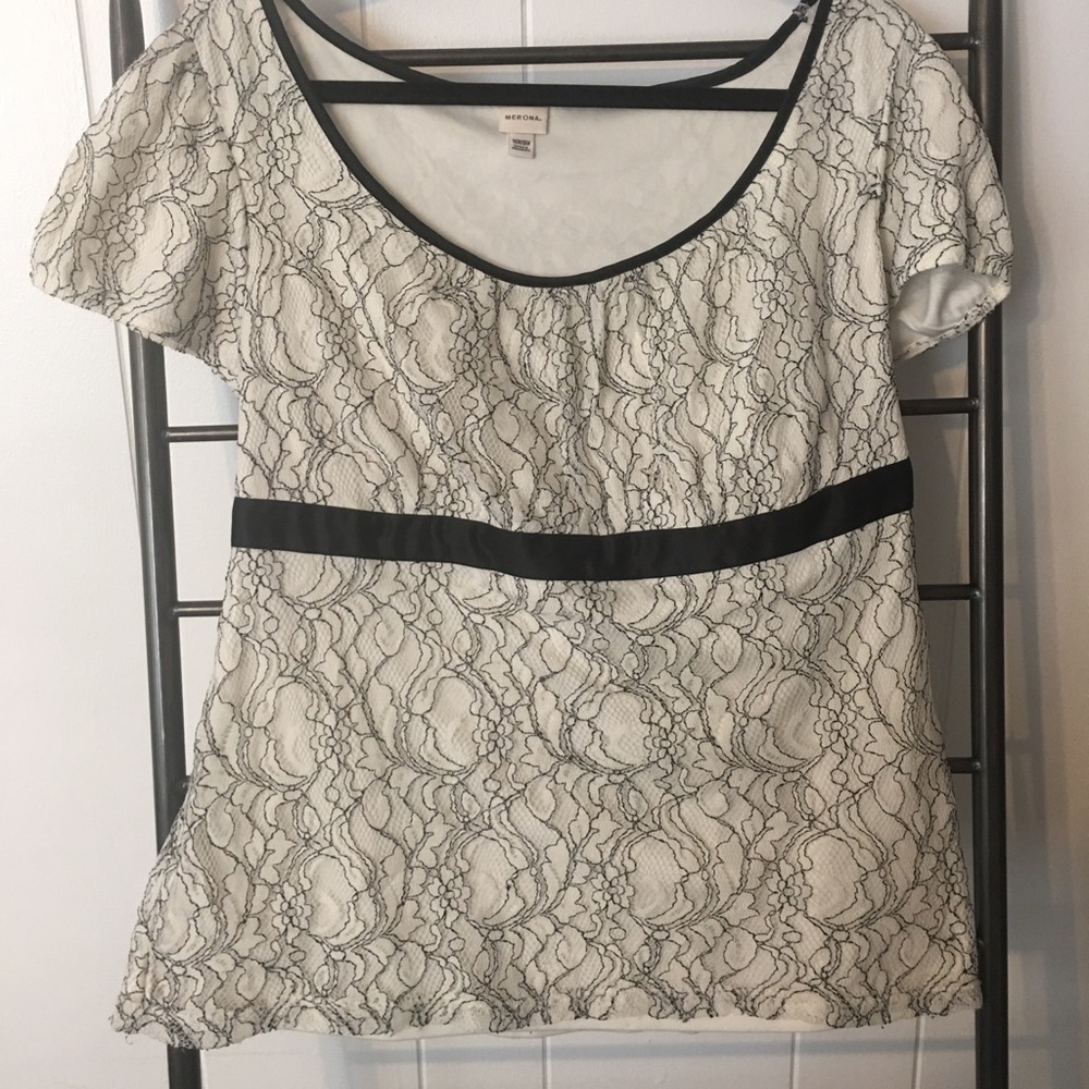 Black and white top with lace overlay.